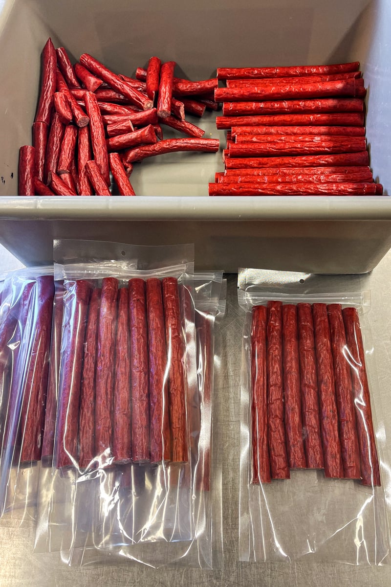 Smoked jalapeño cheddar snack sticks ready for storage in the refrigerator or freezer.