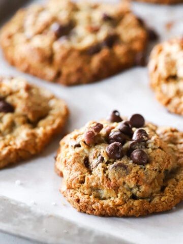 Detailed view of the best Cowboy Cookies with fresh-milled flour and thick, chewy, hearty cookies packed with oats, coconut, pecans, and chocolate.