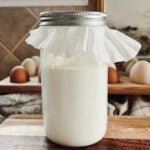 A clabber culture in a mason jar covered loosely with a coffee filter.