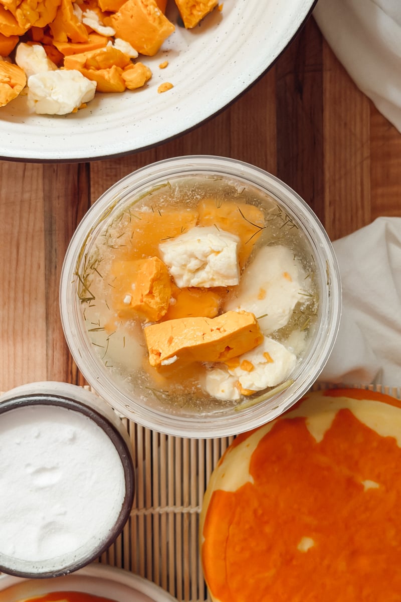 Cheddar cheese curds in a dill pickle brine.