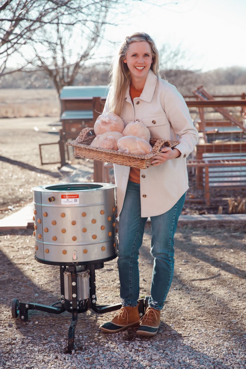 Megan from Ninnescah Homestead holding fresh chicken for the freezer.
