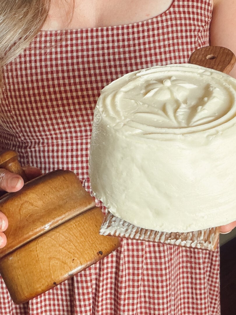 Homemade butter with a flower design made using an antique wooden butter mold.